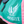 A custom saddle towel with blue, white, and pink colors, featuring embroidery on the sides.