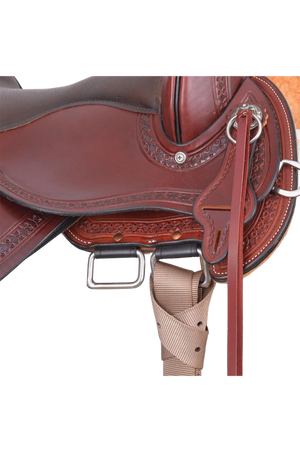 A red leather Circle Y Buffalo Gap Trail saddle with a fiberglass reinforced tree and a double buckle rigging system.