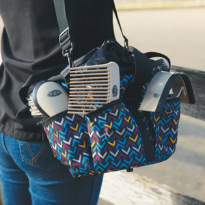 Colorful patterned bag with grooming tools including a brush and comb.