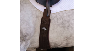 Brown saddle girth strap on a horse with a white background
