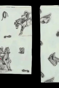 Two patterned napkins with cowboy and horse design on a light green background