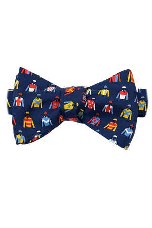 A bow tie with a pattern of jockey silks in various colors on a navy background.