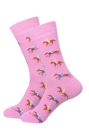 A pair of pink socks with a pattern of horses racing in different colors.