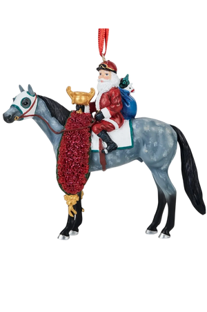 A Santa Claus riding a dapple-gray horse Christmas ornament, featuring a red glittery saddle blanket, a blue sack, and a red hanging loop, shown on a plain white background.