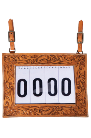 A tooled-leather number holder with adjustable straps and a white display for contestant numbers.