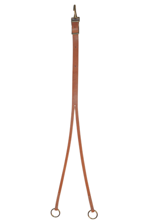 Brown leather training fork with metal rings on a white background