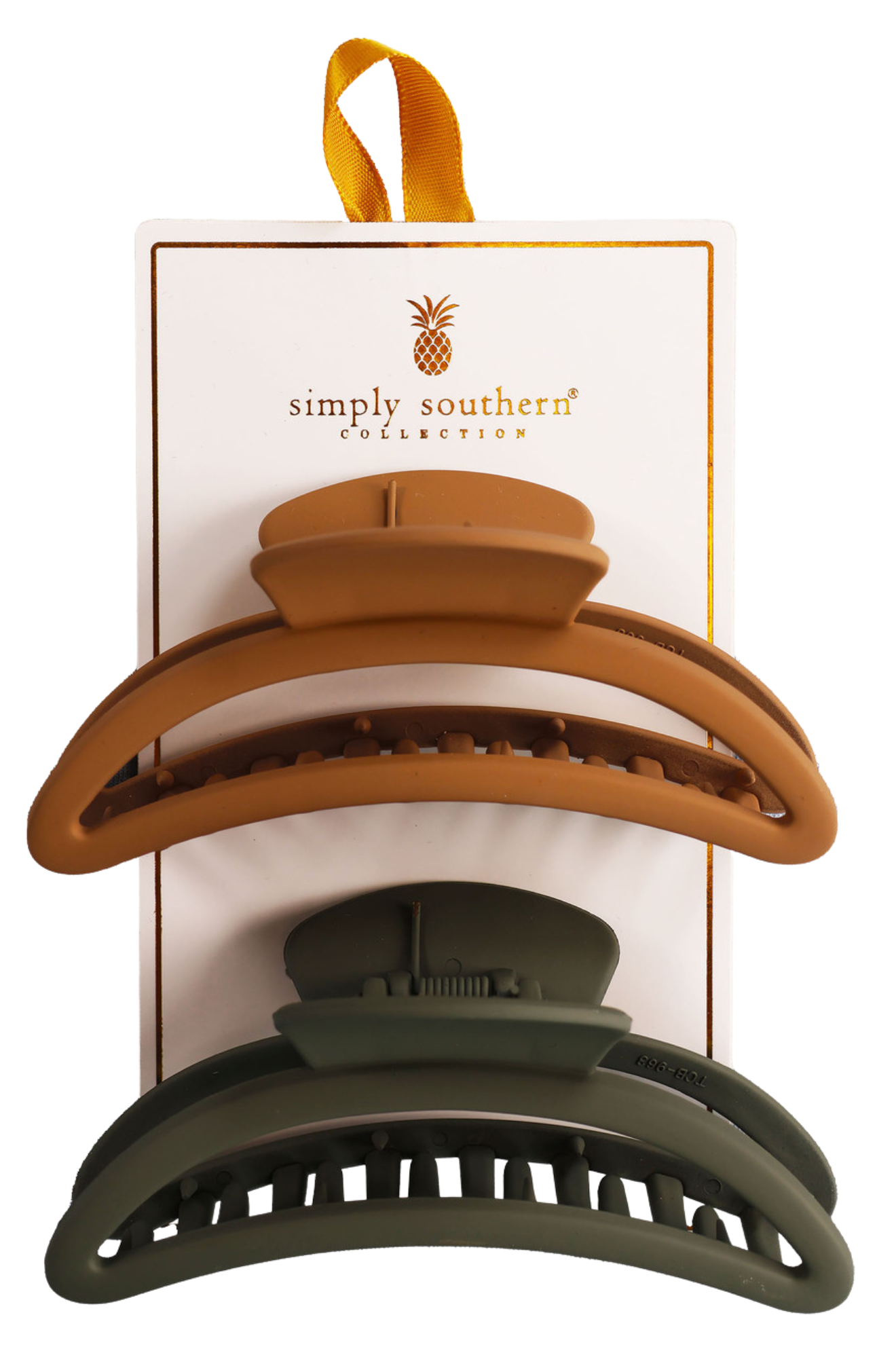 Two hair clips, one green and one brown, displayed on a vertical cardboard stand with a logo at the top.