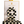 Two hair clips, one green and one brown, displayed on a vertical cardboard stand with a logo at the top.