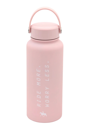 A pink insulated water bottle with white text 'Ride More, Worry Less' and a small graphic of a horse.