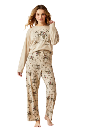 A woman wearing a beige pajama set with animal print patterns, standing against a solid background.