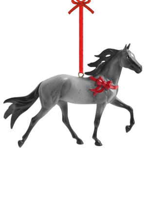 A festive holiday ornament of a gray Tennessee Walking Horse with a red bow around its neck, designed by artist Sommer Prosser.