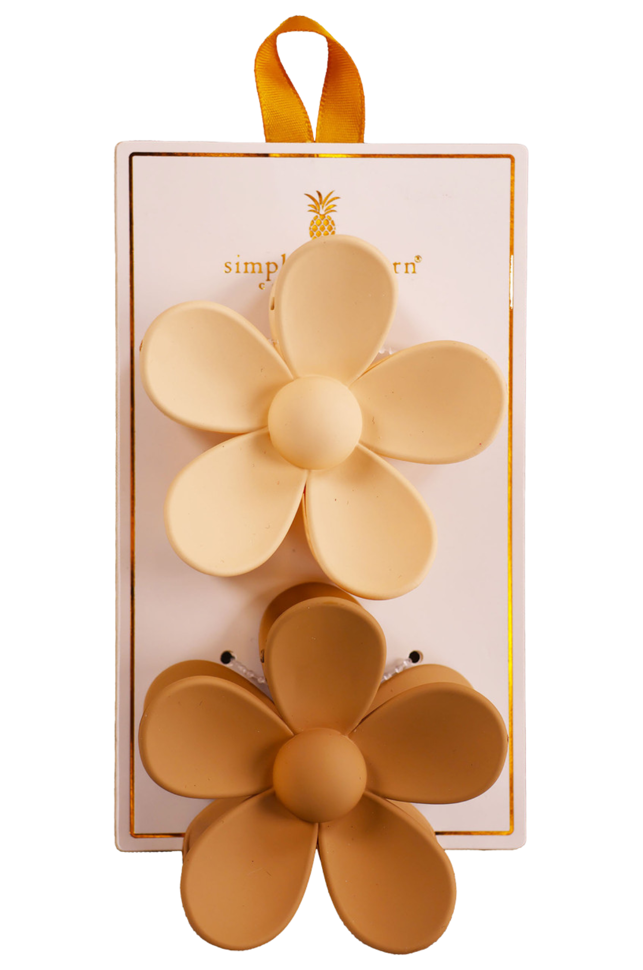 Two hair clips, one green and one brown, displayed on a vertical cardboard stand with a logo at the top.