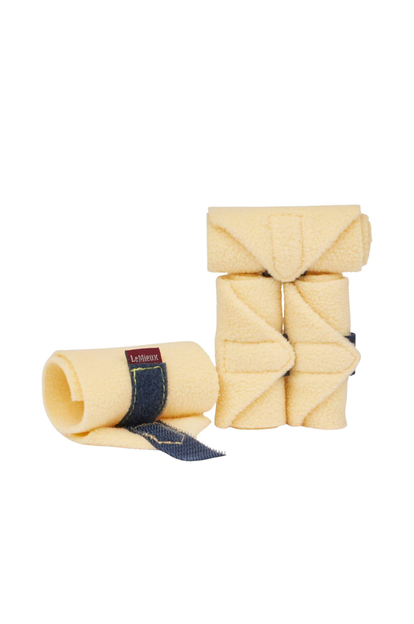 Two beige horse leg wraps with denim accents on a white background