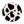 Round object with black and white cow print pattern on a white background