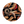 Circular design featuring cowboy boots and lasso on a black background