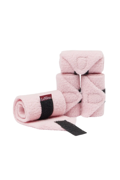 Pink horse with black straps on a white background