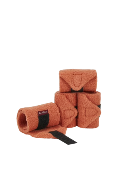 Set of brown horse leg wraps with black straps on a white background