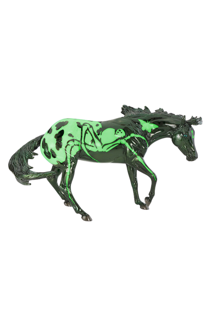 Toy horse with green design on a white background