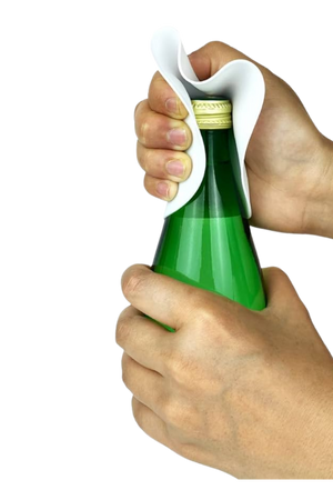 Person using a bottle opener to open a green bottle with a white background