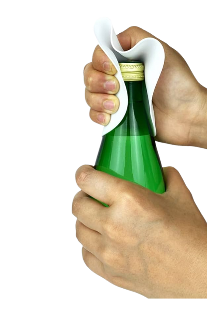 Person using a bottle opener to open a green bottle with a white background