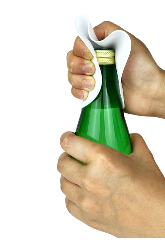 Person using a bottle opener to open a green bottle with a white background