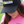 Person wearing a black cap and pink shirt with 'Tack Shack of Ocala' branding.