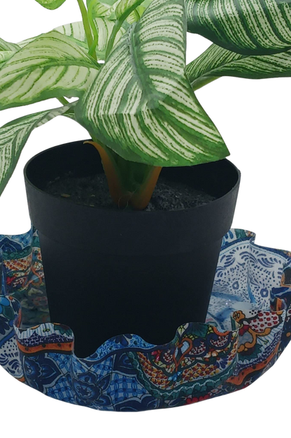 Potted plant on a colorful fabric coaster