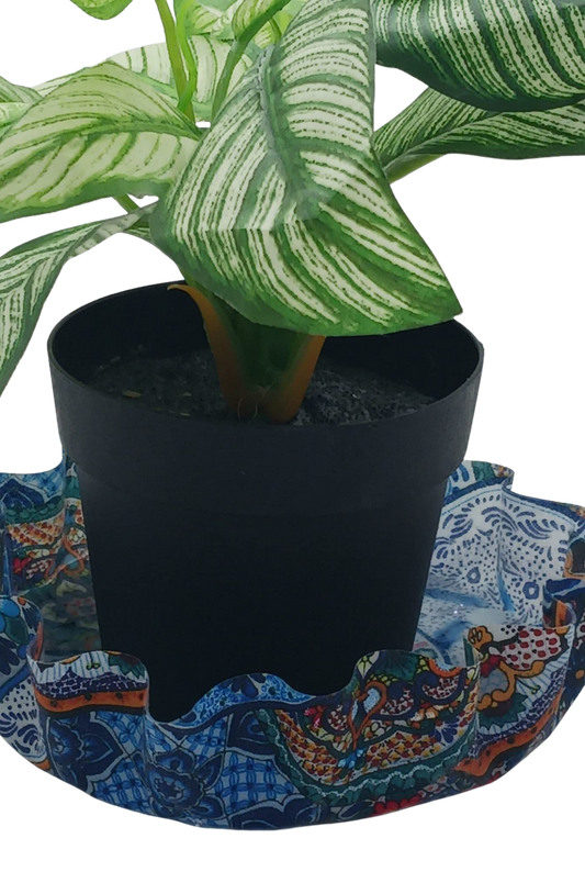 Potted plant on a colorful fabric coaster