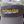 Gray cap with 'Tack Shack of Ocala' logo on a wooden post with a blurred background