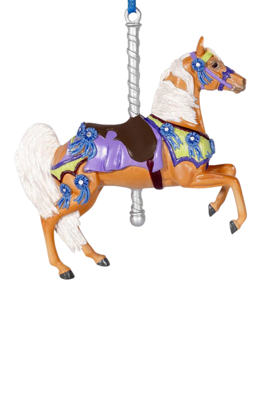 Decorative horse ornament with colorful saddle and blue accents on a white background