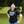 Person wearing a black t-shirt with colorful text in an outdoor setting