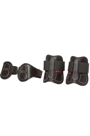 Set of four black and gray protective horse boots on a white background